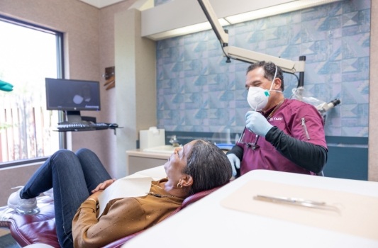 Doctor Vaziri explaining root canal retreatment to a Lorain dental patient